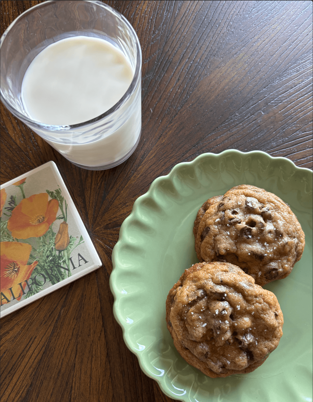 Cookies on a green plate next to a coaster